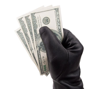 black glove holding hundred dollar bills 