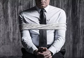 Kidnapped man in ropes 
