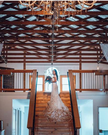 Bride posing on stairs.