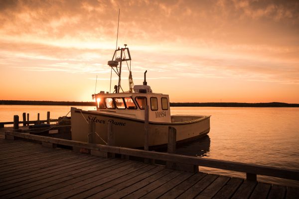 boat on water and sunset