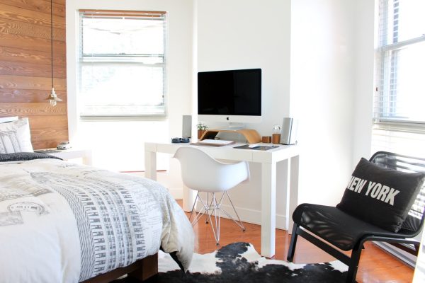 Image of dorm with computer and bed