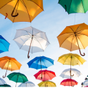 colorful umbrellas floating in the sky